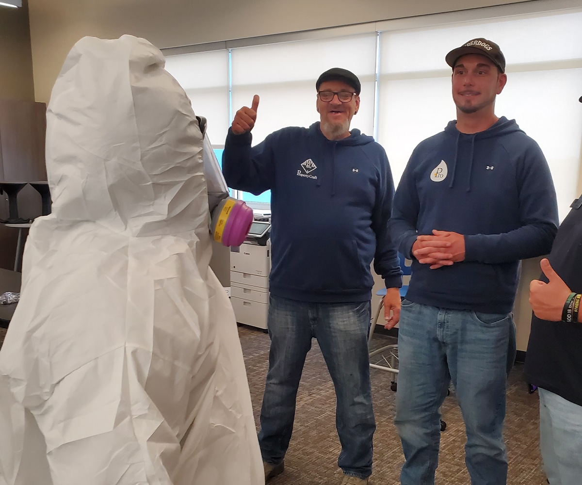 a group of people standing in a room