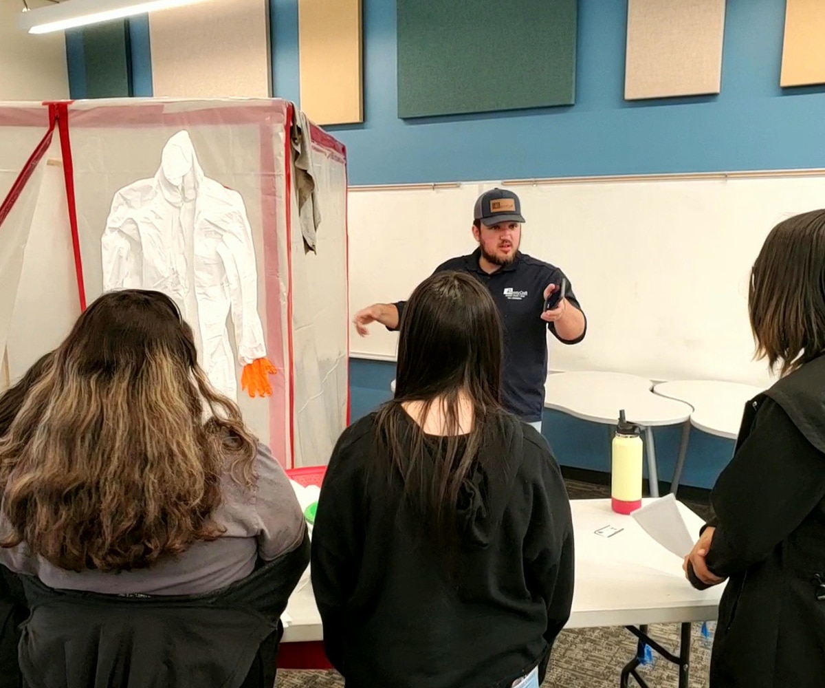 a group of people standing in a room