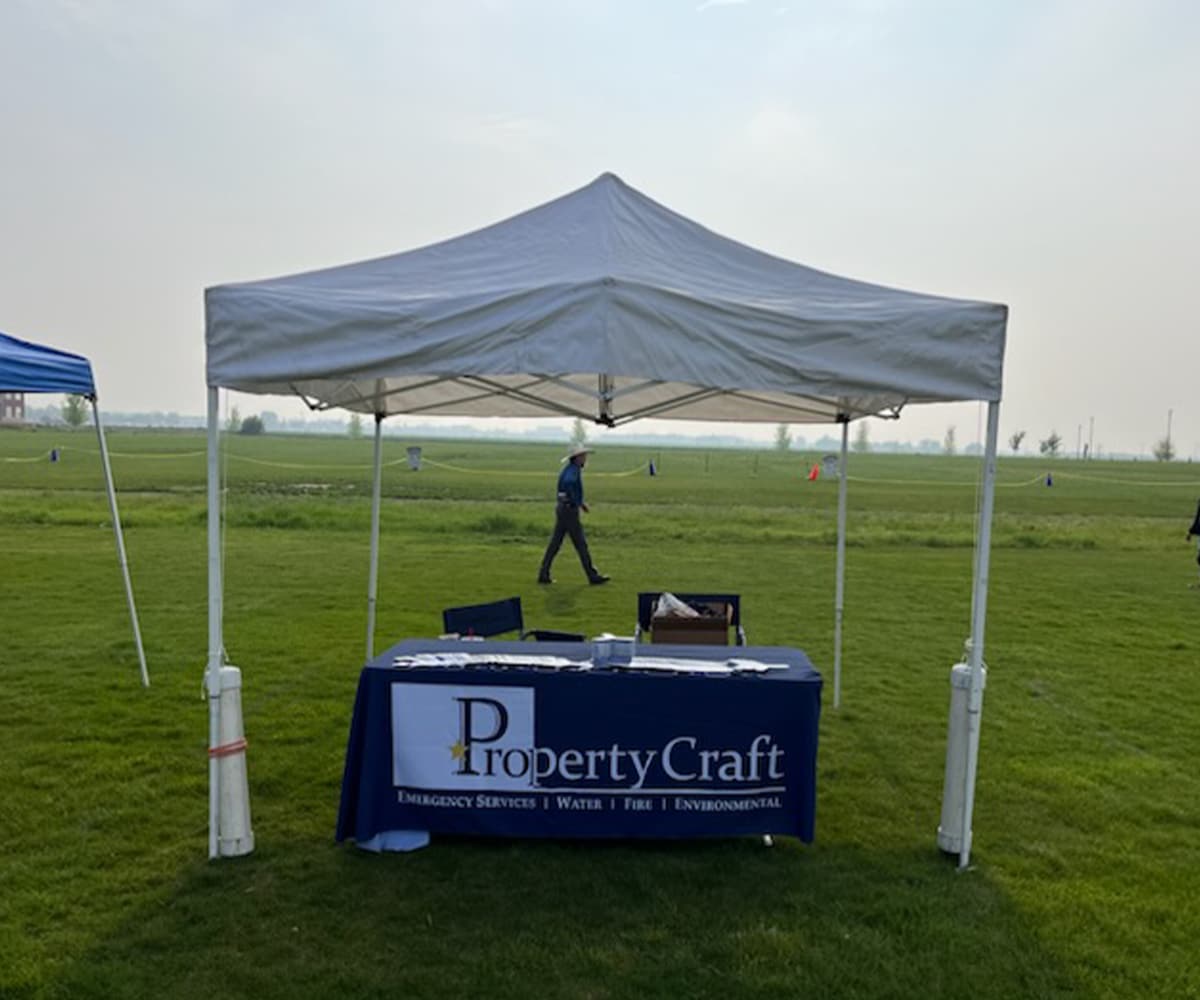 Property Craft table and tent set up in a field for a community event Kite Festival