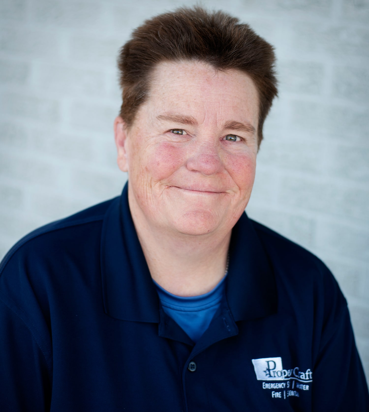 a man in a blue shirt