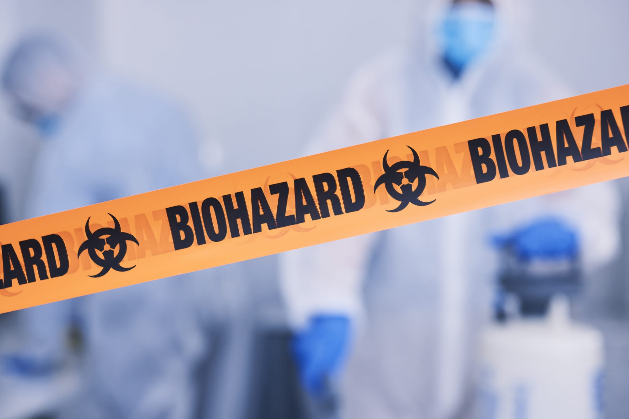 Biohazard tape sectioning off part of a property after recent event