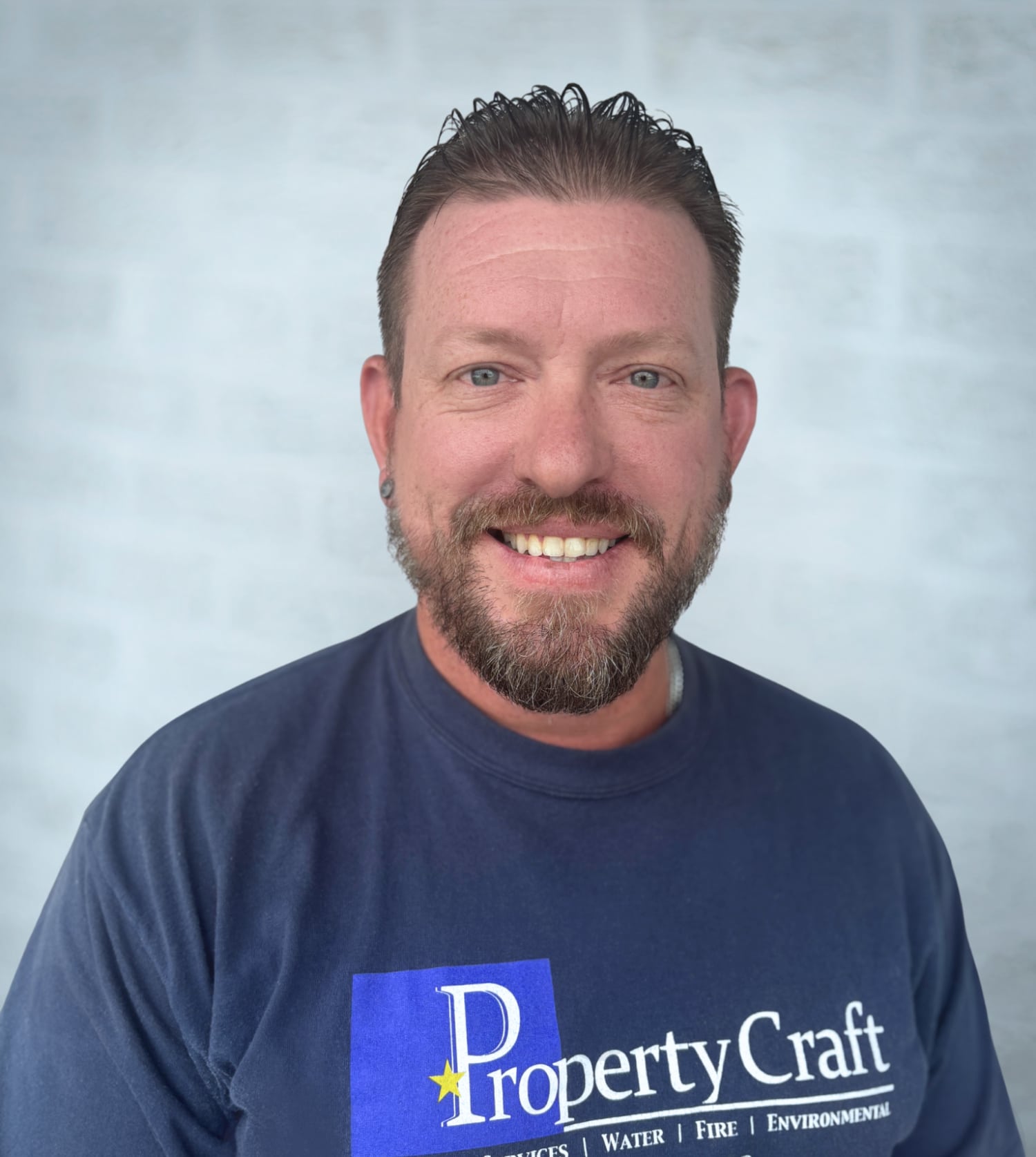 a man wearing a blue shirt